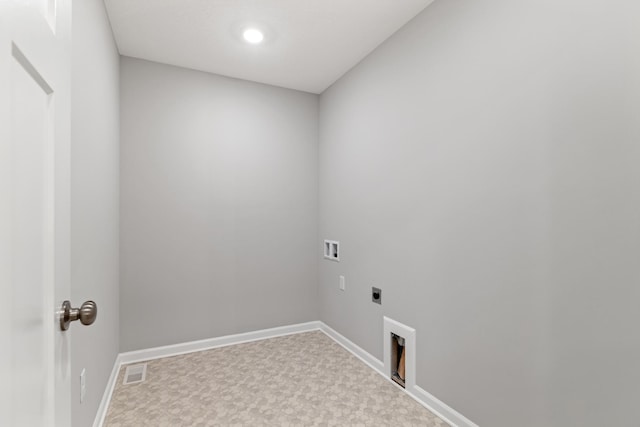 clothes washing area with visible vents, baseboards, hookup for an electric dryer, hookup for a washing machine, and laundry area