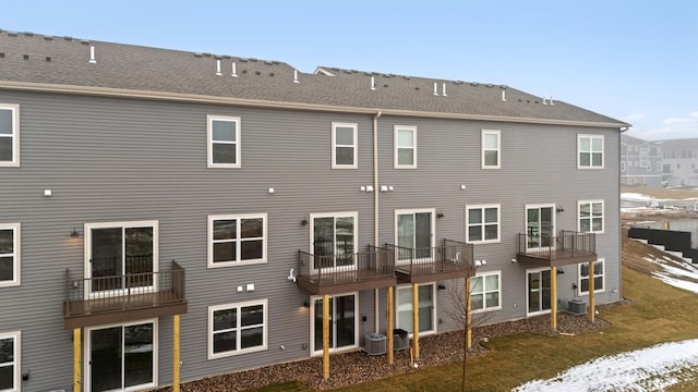 rear view of property featuring cooling unit