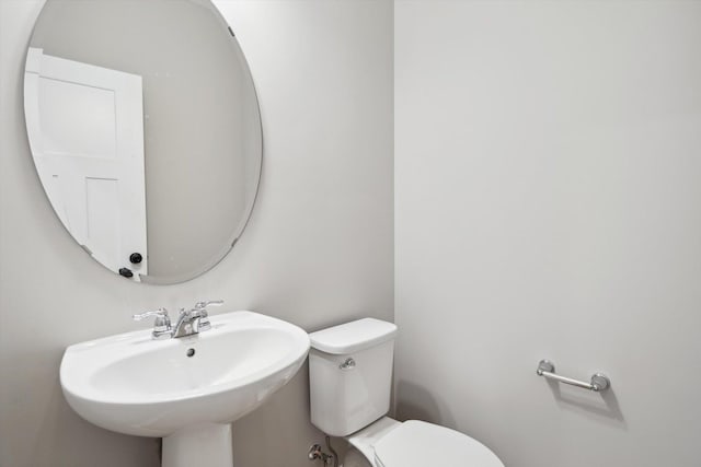 bathroom featuring toilet and a sink