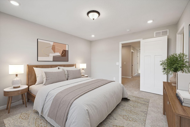 bedroom with recessed lighting, visible vents, baseboards, and light colored carpet