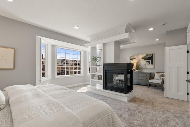 10814 Falling Water Ln Unit D, Woodbury, MN 55129 - bedroom featuring light carpet, recessed lighting, a multi sided fireplace, and baseboards