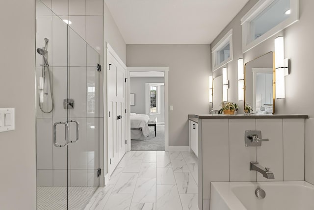 10814 Falling Water Ln Unit D, Woodbury, MN 55129 - bathroom featuring marble look tile flooring, connected bathroom, a shower stall, vanity, and baseboards