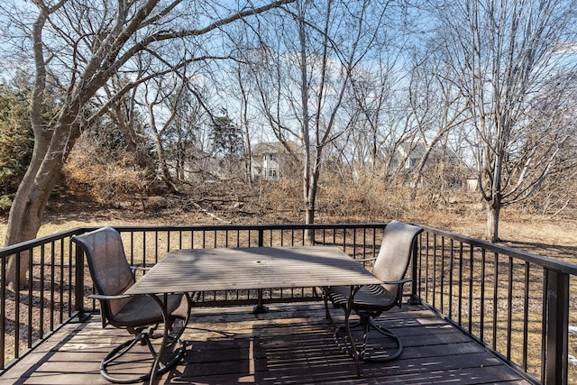 wooden deck with outdoor dining space