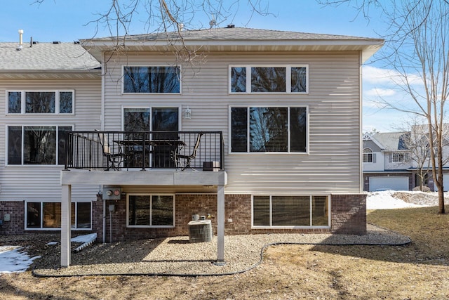 rear view of property featuring central air condition unit