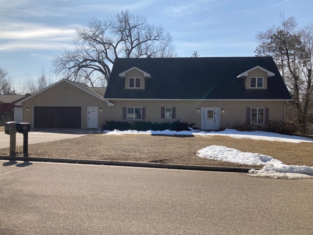 view of front of house featuring a garage and concrete driveway