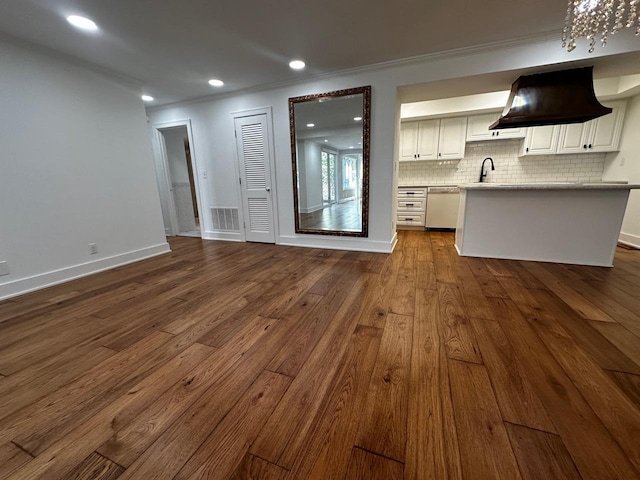 kitchen featuring visible vents, backsplash, open floor plan, dishwashing machine, and dark wood-style flooring