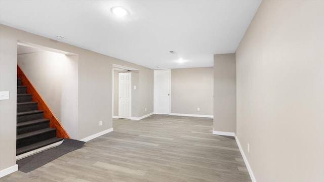 interior space with recessed lighting, stairs, baseboards, and wood finished floors