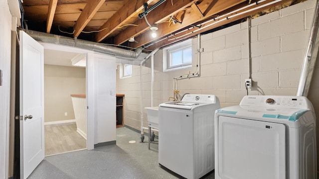 clothes washing area featuring laundry area and washer and dryer