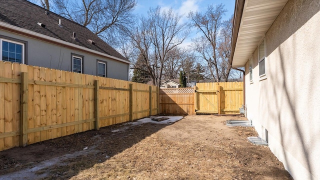 view of yard featuring a gate and fence