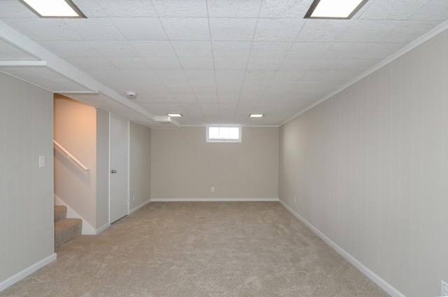 basement with stairs, baseboards, and light carpet