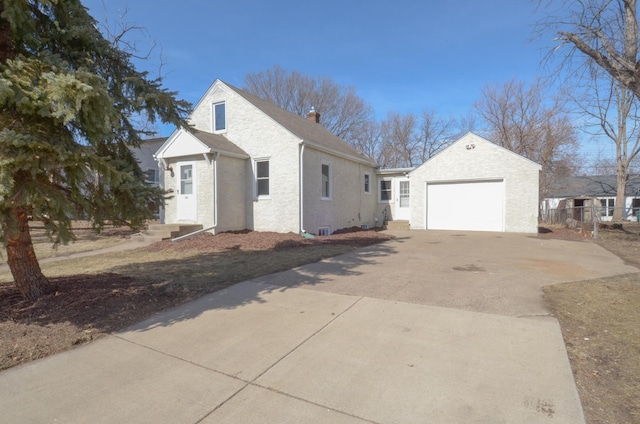 view of side of property with a chimney, concrete driveway, a garage, and fence