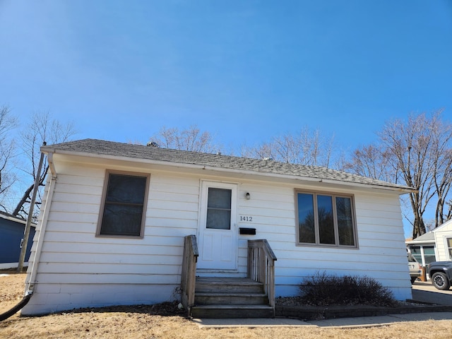 bungalow with roof with shingles