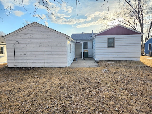 back of property with a patio