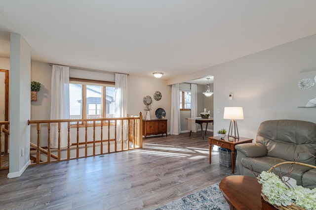 living room featuring wood finished floors and baseboards