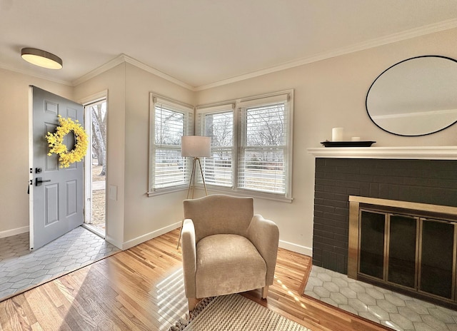 foyer featuring baseboards, wood finished floors, and ornamental molding