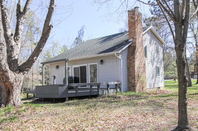 13237 Norway Dr, Baxter, MN 56425 - rear view of house featuring a chimney, a wooden deck, and a shingled roof
