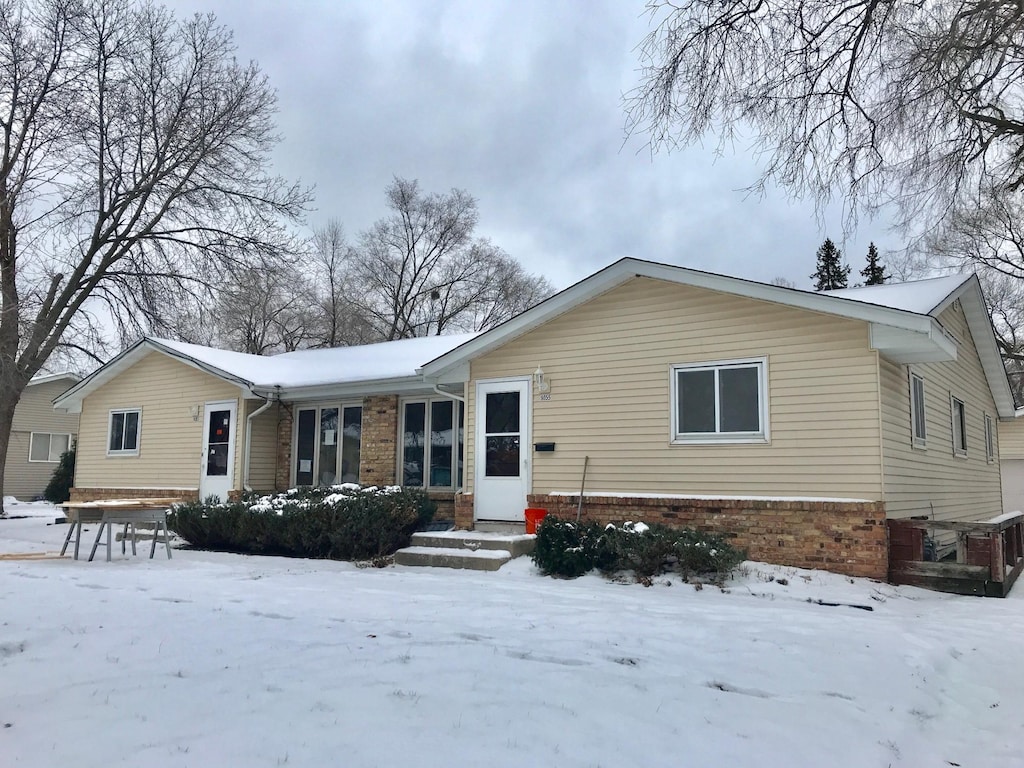 ranch-style house with brick siding