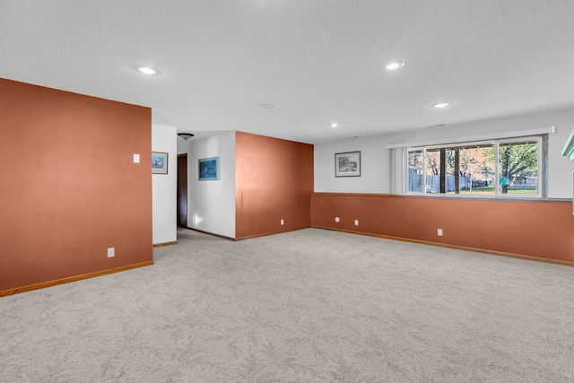 unfurnished room with carpet, recessed lighting, and baseboards