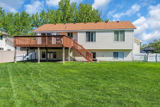 rear view of property featuring a wooden deck and stairway