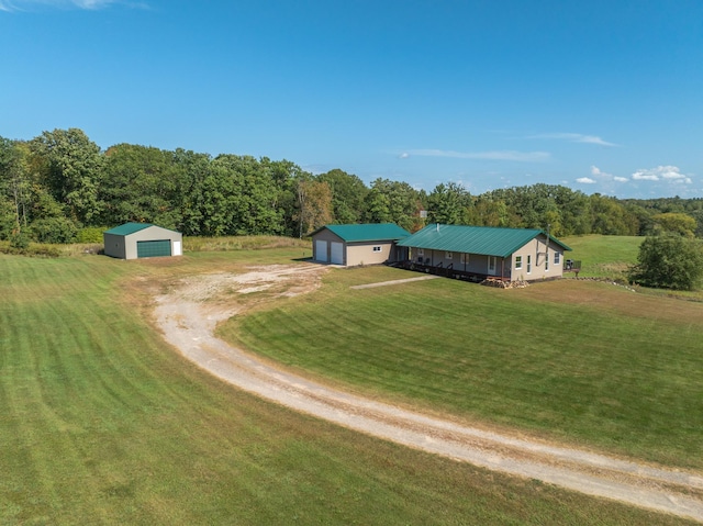 bird's eye view with a wooded view