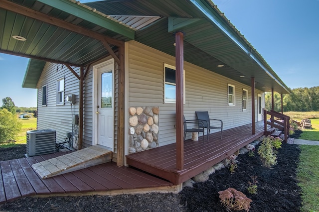 wooden deck with a porch and central AC