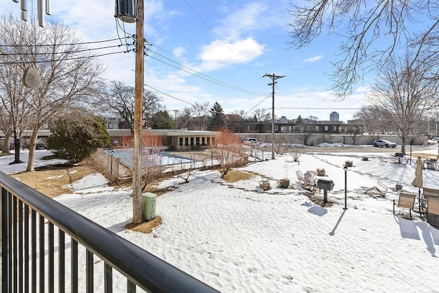 yard covered in snow with fence