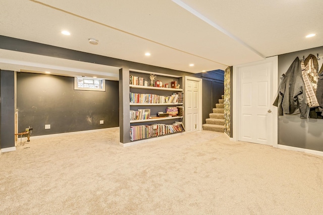 basement with recessed lighting, carpet flooring, and stairs