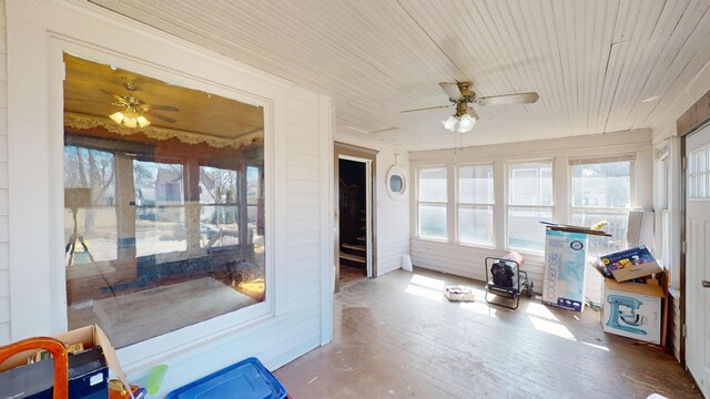 sunroom / solarium with wood ceiling and hardwood / wood-style flooring