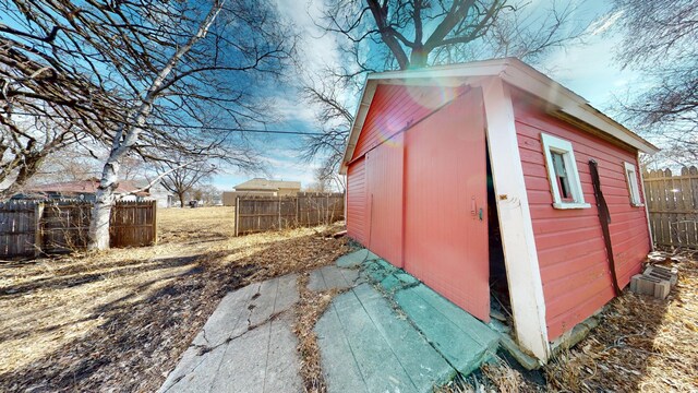 view of shed with fence