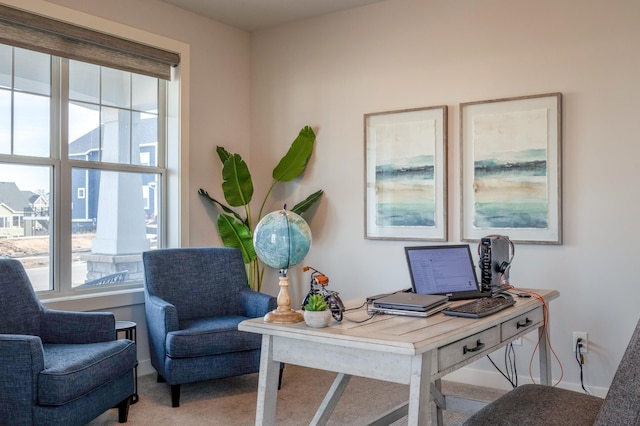 home office featuring baseboards and carpet floors