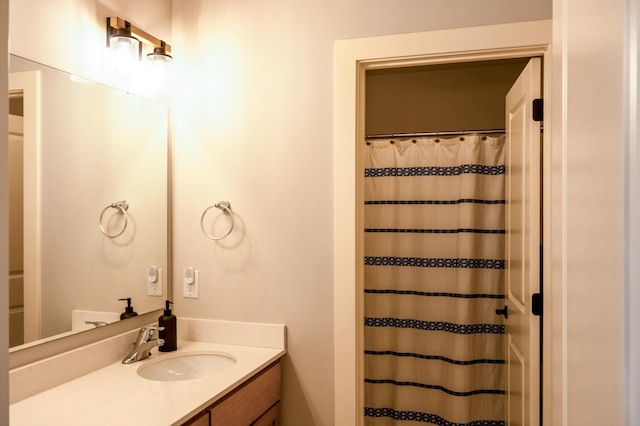 full bathroom with vanity and a shower with shower curtain