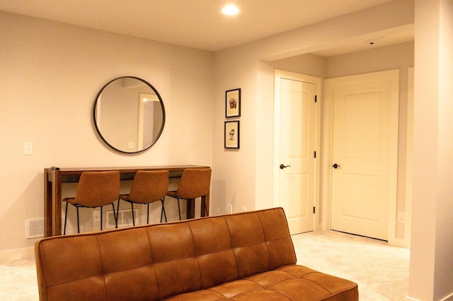 living room featuring recessed lighting, visible vents, carpet flooring, and baseboards