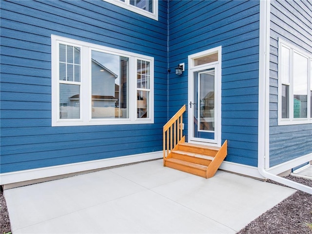 property entrance with a patio