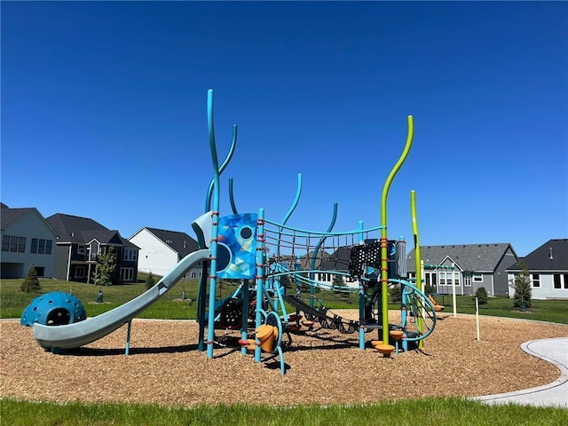 community play area featuring a residential view and a lawn