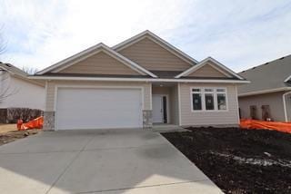 view of front of property with driveway and a garage