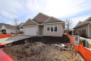 view of front of home featuring an attached garage and driveway