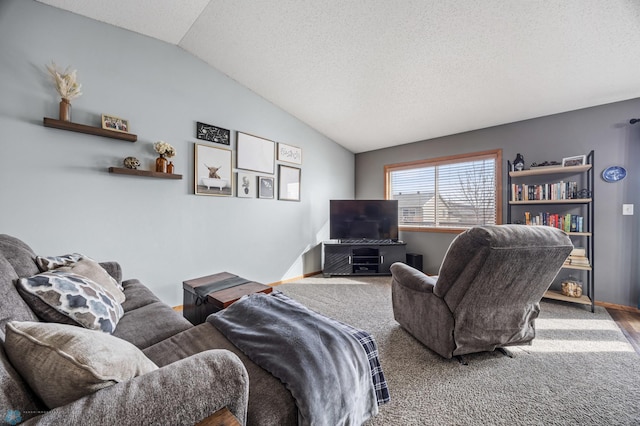 living area featuring a textured ceiling and vaulted ceiling