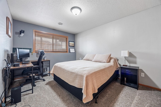 bedroom featuring baseboards, carpet floors, and a textured ceiling