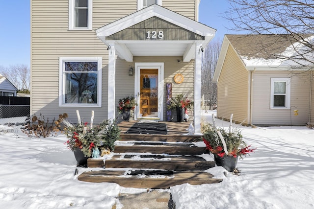 view of snow covered property entrance