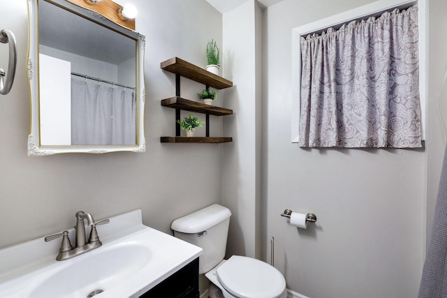 full bath featuring vanity and toilet