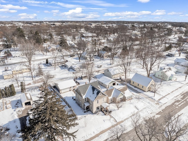 snowy aerial view featuring a residential view