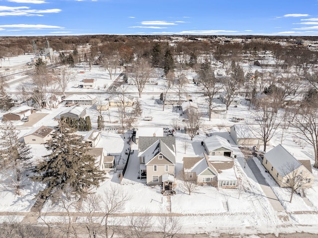 snowy aerial view featuring a residential view