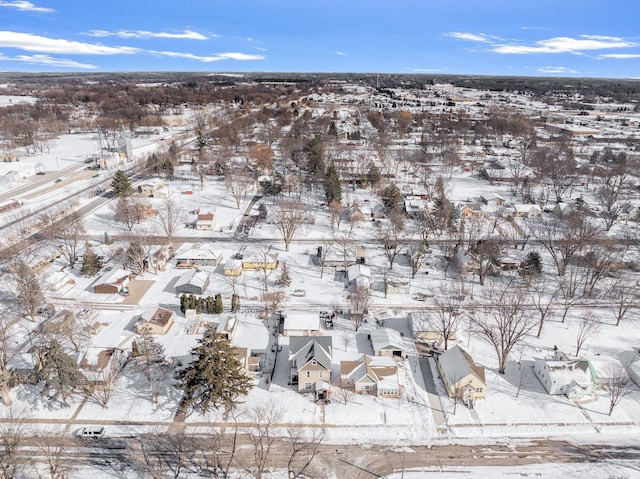 snowy aerial view featuring a residential view