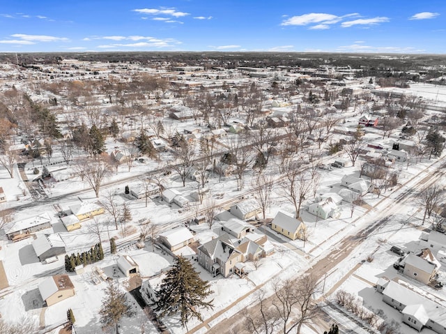 snowy aerial view featuring a residential view