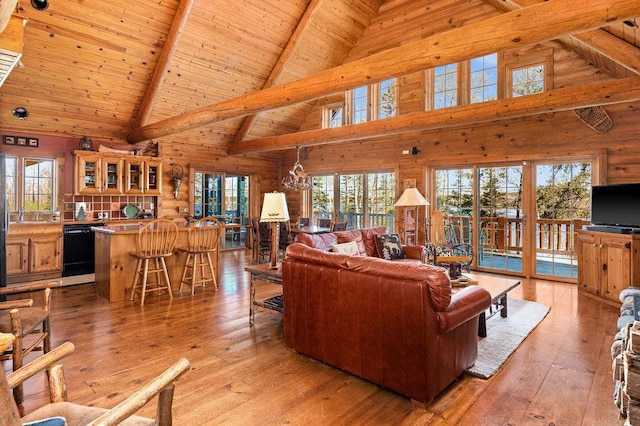 living room featuring wood ceiling, wood walls, vaulted ceiling with beams, and light wood finished floors