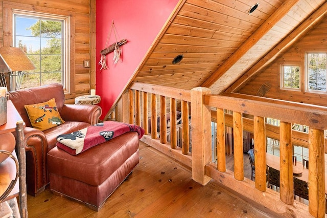 living area with rustic walls, wood ceiling, lofted ceiling with beams, and wood-type flooring