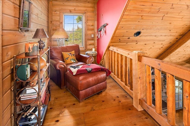 living area featuring wood ceiling, log walls, and hardwood / wood-style flooring