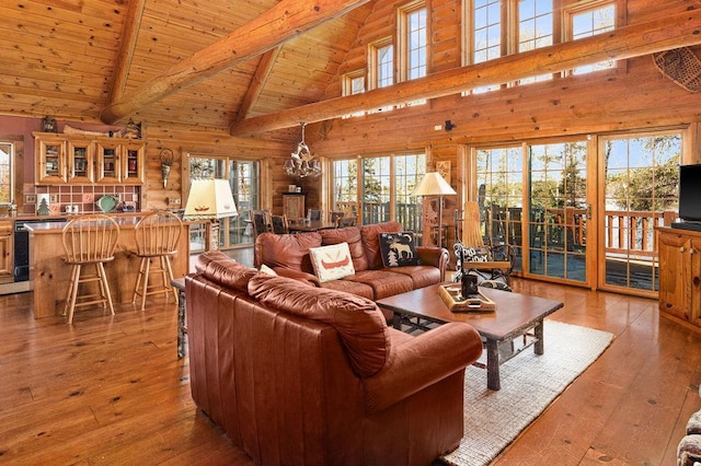 living room with hardwood / wood-style floors, beam ceiling, wooden ceiling, and a chandelier