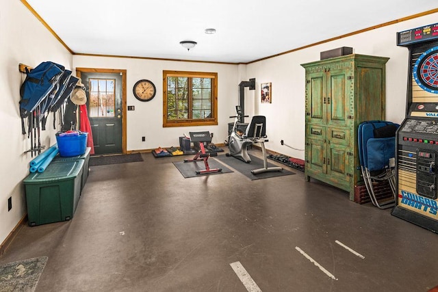 exercise area with crown molding and baseboards