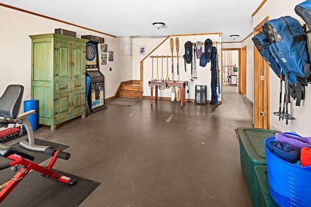 interior space with baseboards and ornamental molding